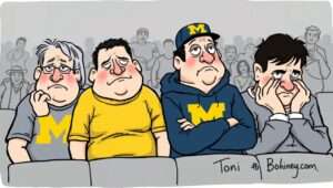 A conceptual image of a shattered football helmet placed on top of official termination documents.